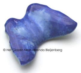 Kleine blauwe glas vlinder