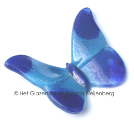 Kleine blauwe vlinder van glaskunst