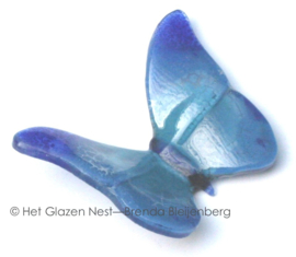 Vliegende blauwe glazen vlinder