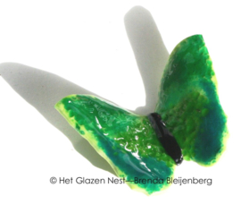 Vrolijke vlinder in grasgroene kleuren