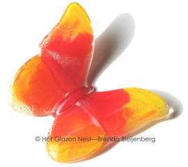 Oranje vlinder in glaskunst