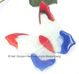 vlinder in rood, wit en blauw