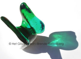 Glazen vlinder in gras en zee groen