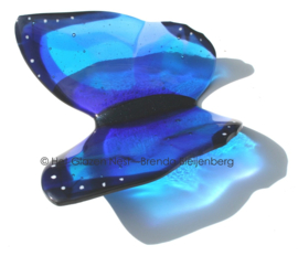 Blauwe glas vlinder voor grafsteen