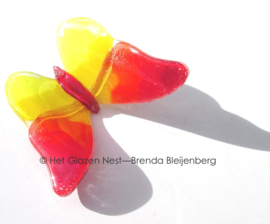 Slanke vlinder in rood en geel