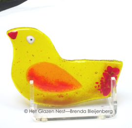 Geel vogeltje in doorzichtig glas