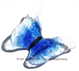 Blauwe vlinder in doorzichtig glas