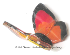Kleine oranje vlinder van glaskunst
