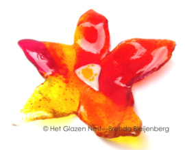 Speelse bloem in glas