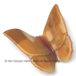 Abstract glazen vlinder in zandkleuren