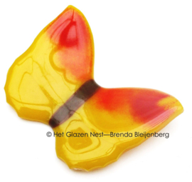 Gele glas vlinder met rode accenten