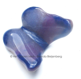 Kleine paarse glas vlinder