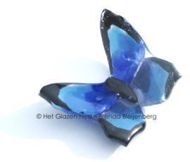 Klein blauw vlindertje van glas