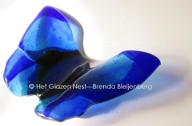 blauwe vlinder in transparant glas