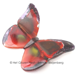 Rode vlinder met zware randen van glas