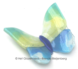 Glazen vlinder in zachte kleuren