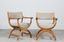 Pair of Danish Henning Kjærnulf Kurul Chairs by EG Møbler of Oak and Sheep Skin