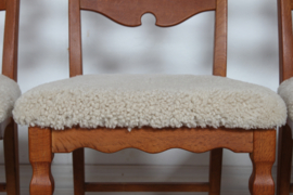Set of 6 Danish Henning Kjærnulf Chairs for EG Furniture. Made of Solid Oak with New Sheepskin, 1970s. Danish Modern Furniture.