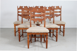 Set of 6 Danish Henning Kjærnulf Chairs for EG Furniture. Made of Solid Oak with New Sheepskin, 1970s. Danish Modern Furniture.