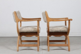 Pair of Danish Henning Kjærnulf Kurul Chairs by EG Møbler of Oak and Sheep Skin