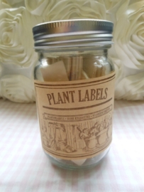 Houten plantenlabels in glazen pot