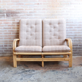 Vintage rotan bank met kussen