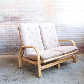 Vintage rotan bank met kussen