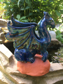 Blue and green dragon sculpture with Dragon Stone