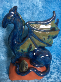 Blue and green dragon sculpture with Dragon Stone