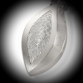 Oval pendant for ashes with fingerprint