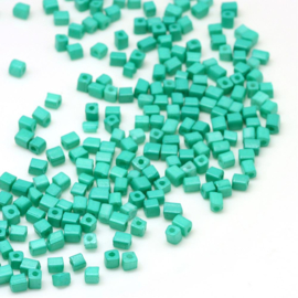 R100- 20gram glazen ruwe rocailles 3-7mm groen turquoise