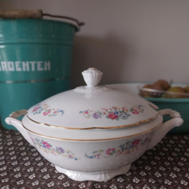 Oude dekschaal met bloemetjes