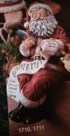 K 1710-11 Zittende kerstman met pluim