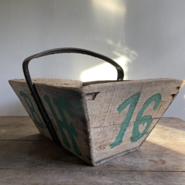 BU20110146 Rustic old French grape harvest basket with the initials  B. H. of the vineyard. Period: early 1900s. In beautiful, weathered condition. Size: 52 cm long / 29 cm high (up to iron handle) / 34.5 cm. cross section.