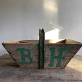 BU20110146 Rustic old French grape harvest basket with the initials  B. H. of the vineyard. Period: early 1900s. In beautiful, weathered condition. Size: 52 cm long / 29 cm high (up to iron handle) / 34.5 cm. cross section.