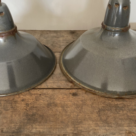 BU20110098 Set of 2 in size different, but colour-matched, French enamel outdoor lamp shades in grey. In beautiful weathered condition! Long hung in our plane trees .... Size: 35.5 cm & 30.5 cm. cross section / height +/- 23 cm.