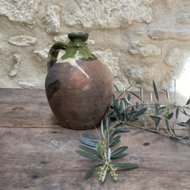 AW20110936 Antique 19th century French olive oil jug in weathered green and earthy tones. In beautiful condition! Size: 24 cm. high / 17.5 cm. cross section (over the belly)
