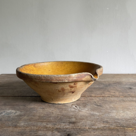 AW20111117 Antique Belgian cream bowl in beautifully weathered ocher colour period: 19th century. Has a visible and audible crack (see photo 7 & 8) but still so beautiful with garlic or shallots. Size: 25 cm cross section / 10 cm. high