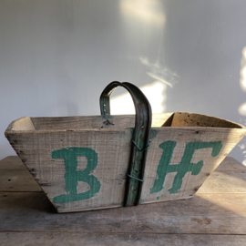 BU20110146 Rustic old French grape harvest basket with the initials  B. H. of the vineyard. Period: early 1900s. In beautiful, weathered condition. Size: 52 cm long / 29 cm high (up to iron handle) / 34.5 cm. cross section.