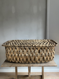 OV20110979 Old French basket made of woven chestnut bark. Still has a semi-original label that reveals its origins - manufacture Oradour - The French village where time has stood still since 1944. Size: 90L x 32H x 51W Pick up only!