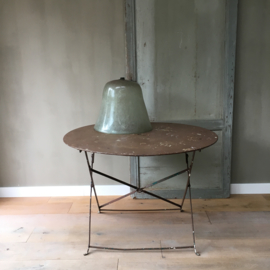 BU20110084 Old French folding terrace table in beautifully weathered earthy color. Has a parasol hole and the ring holder in nice condition! Size: 71 cm. high / +/- 98 cm. section. Pickup only!