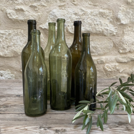 OV20111116 Set of 6 French antique hand-blown glass wine bottles in various beautiful shades of green with the so-called "spirit in the bottle base" in beautiful condition! Size: largest bottle 31 cm high / smallest bottle 25.5 cm high