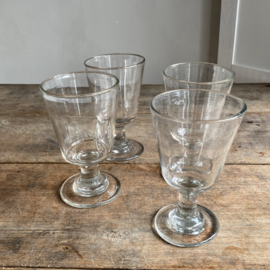 OV20110983 Set of four 19th century French wine glasses made of mouth-blown glass in perfect condition! Each with their own unique appearance. Size:  13,5 cm high / 8 cm cross section.
