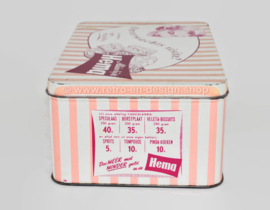 Roze blikken retro trommel voor koek van de Hema met foto's van winkelinterieur