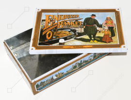 Vintage tin for Enkhuizer banquet with images of a harbour with fishing boats and regional costumes "Marken"