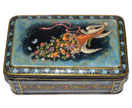 Vintage tin drum with an image of Cornucopia or The horn of plenty