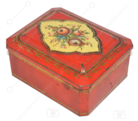 Rectangular red tin with gold-coloured details and floral decoration