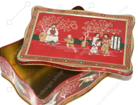 Vintage tea tin in red, green, gold and black with oriental images