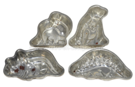 Four vintage dinosaur-shaped baking tins