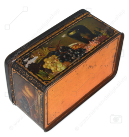 Vintage candy or cookie tin with still lifes of fruit pieces on all sides